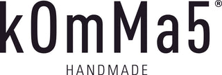 kOmMa5